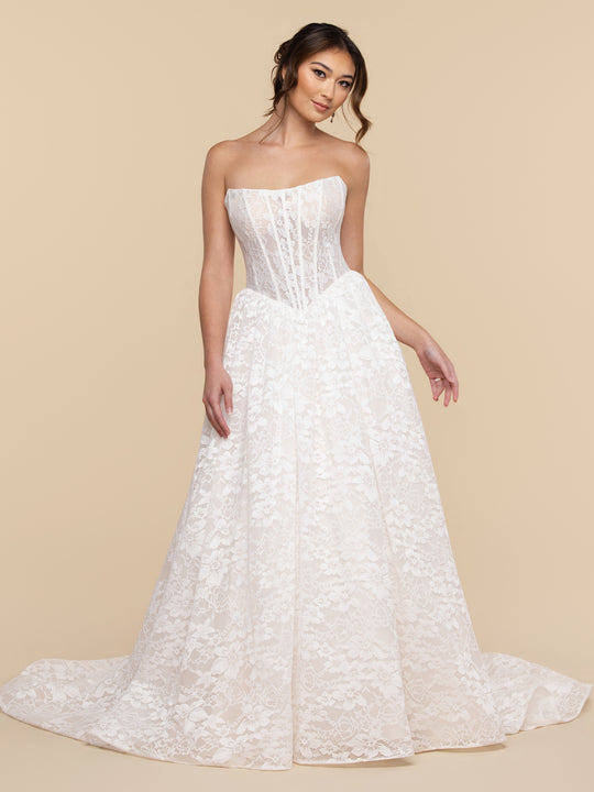 The Wren wedding dress by averyaustin features a strapless, floor-length design with a corset bodice and a full Chantilly lace skirt.