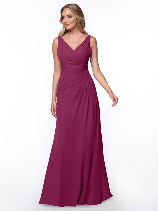 A woman models Avery Austin's 80030: a sleeveless, floor-length magenta sheath dress featuring a V-neck and ruched bodice, posed against a plain white background.