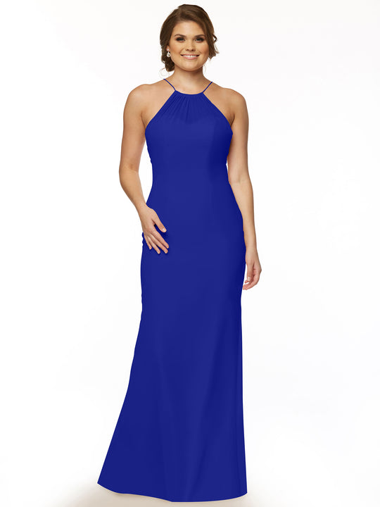 A woman smiles in the Avery Austin 80083, a sleeveless floor-length cobalt halter dress with a keyhole back, standing against a plain white background.