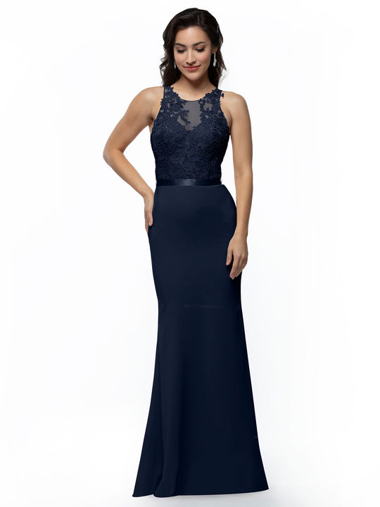 Model wears Avery Austin 80095, a sleeveless, floor-length navy blue gown with a fit-and-flare silhouette, satin skirt, and lace bodice, posing against a white background with a slight smile.