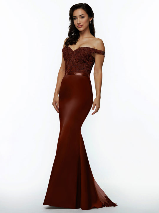 A woman with long dark hair and earrings poses against a white background in Avery Austin style 80104—a burgundy off-the-shoulder bridesmaid dress with a lace bodice and fitted satin skirt.