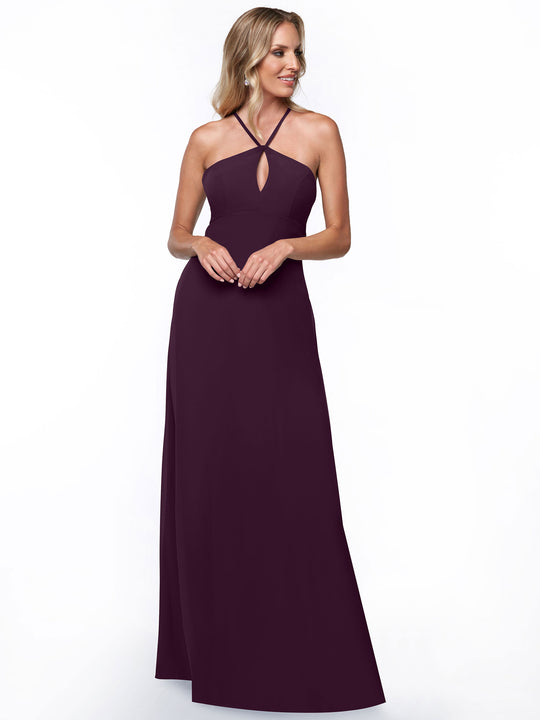 Model wears Avery Austin’s 80137: a floor-length, sleeveless dark purple halter dress with a small front keyhole, shown against a plain white background for a minimalist look.