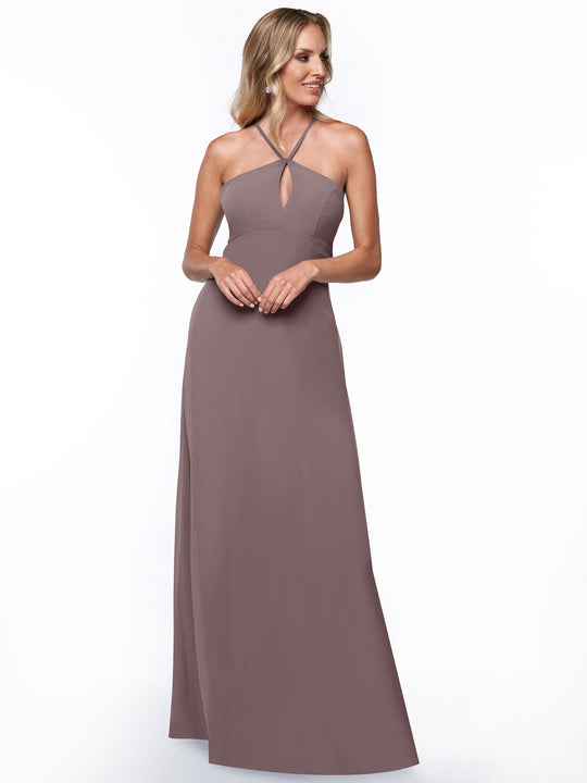 A woman models the Avery Austin 80137: a sleeveless, floor-length mauve halter dress with keyhole front, standing and smiling against a plain white background for a chic, minimalistic look.