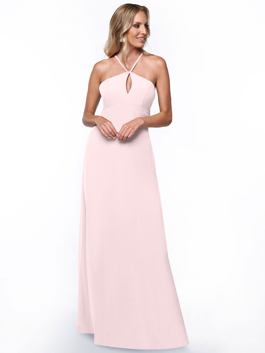 Model wears Avery Austin style 80137, a long pale pink halter dress featuring keyhole cutouts at the chest and back, as she stands against a plain white background with a slight smile.
