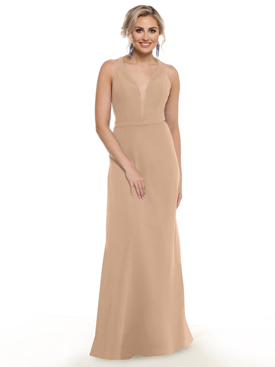 A woman in the Avery Austin 80150, a sleeveless floor-length light beige gown with a plunging neckline, stands against a white background, smiling with her hair in an updo and wearing drop earrings.