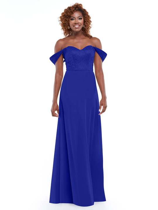 A woman with curly hair smiles, modeling Avery Austin's 80164—a royal blue off-the-shoulder dress with a fitted lace bodice and flowing chiffon skirt—against a plain white background.