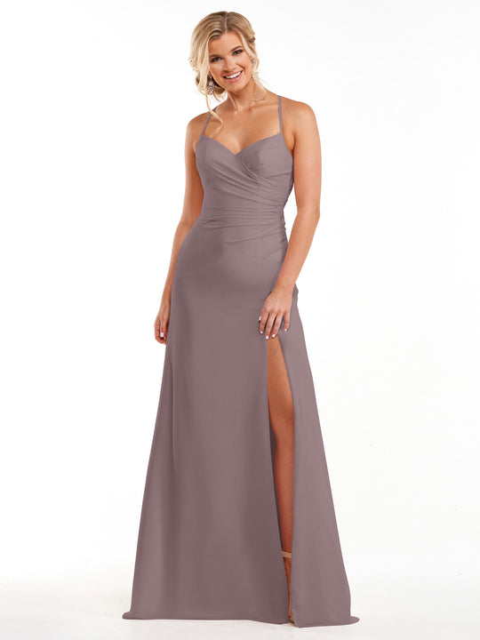 A woman wearing Avery Austin's 80167 mauve chiffon dress with spaghetti straps, a sweetheart neckline, and a thigh-high slit stands smiling against a plain white background.