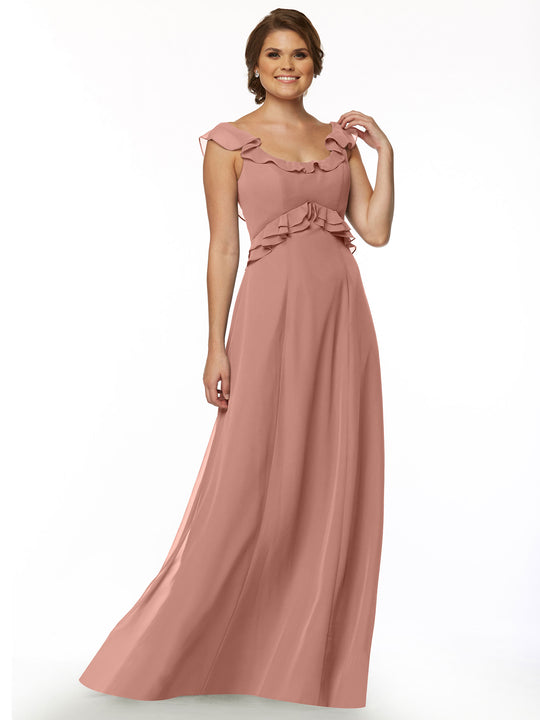 A woman smiles against a plain white background, wearing Avery Austin's 80173—a long, flowing dusty rose off-the-shoulder dress featuring ruffle details along the neckline and waist.