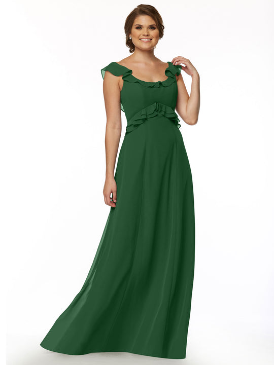 A woman stands and smiles against a plain white background, wearing Avery Austin’s floor-length sleeveless dress (style 80173) with ruffled neckline at the shoulders and waist.