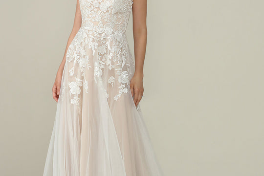 Avery Austin wedding dress styled with a veil and bridal jewelry