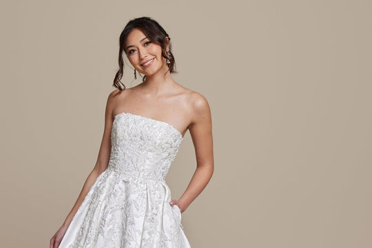 Classic ivory wedding dress with pockets - engagement season timeline