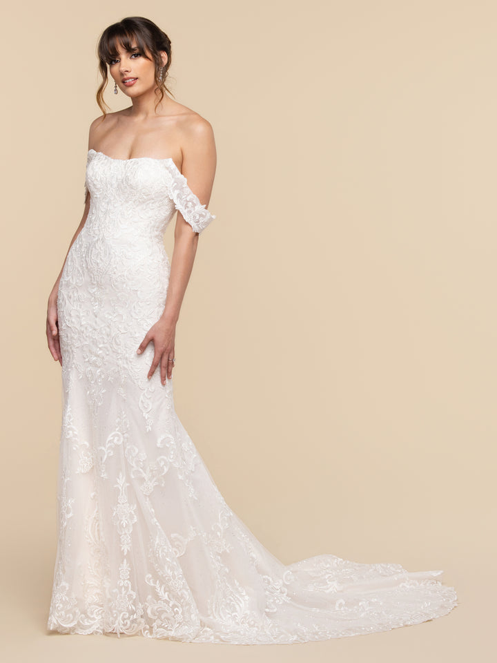 Avery Austin Lilia off-the-shoulder ivory and sand lace bridal gown in a fit-and-flare silhouette, featuring a sweetheart neckline and a train.