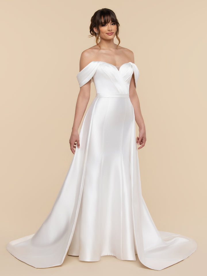 Thea by averyaustin is an off-the-shoulder diamond white wedding gown with a sweetheart neckline and a fit-and-flare silhouette featuring a floor-length skirt with a train.