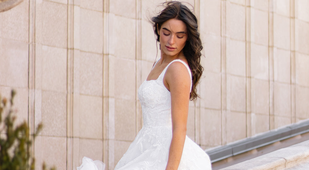 Bride trying on wedding dress at home