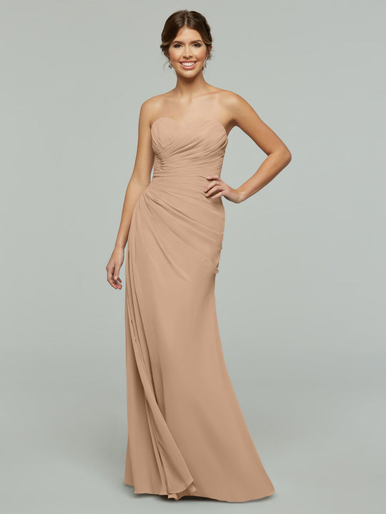 Model in Avery Austin 80028: a strapless, floor-length chiffon dress with a sweetheart neckline and ruched details, posing against a plain studio backdrop.