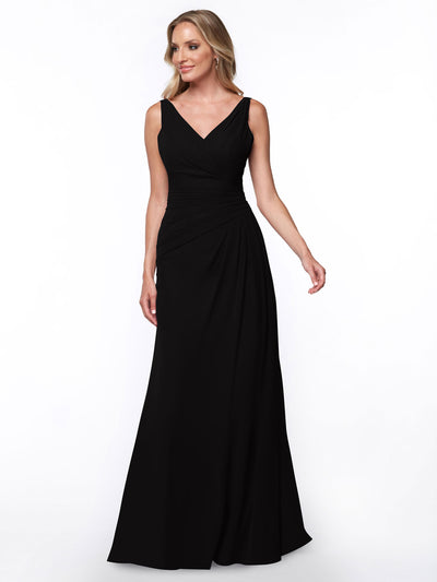 A woman models Avery Austin's 80030—a sleeveless, floor-length black sheath dress with a V-neckline and ruched bodice—against a plain white background.