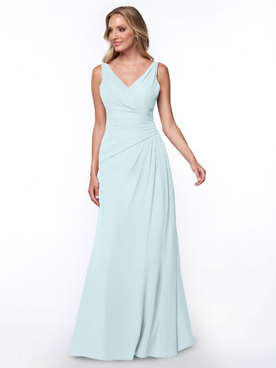 A woman models Avery Austin’s 80030: a sleeveless, light blue, floor-length sheath dress with a V-neckline and ruched bodice, standing against a plain white background.