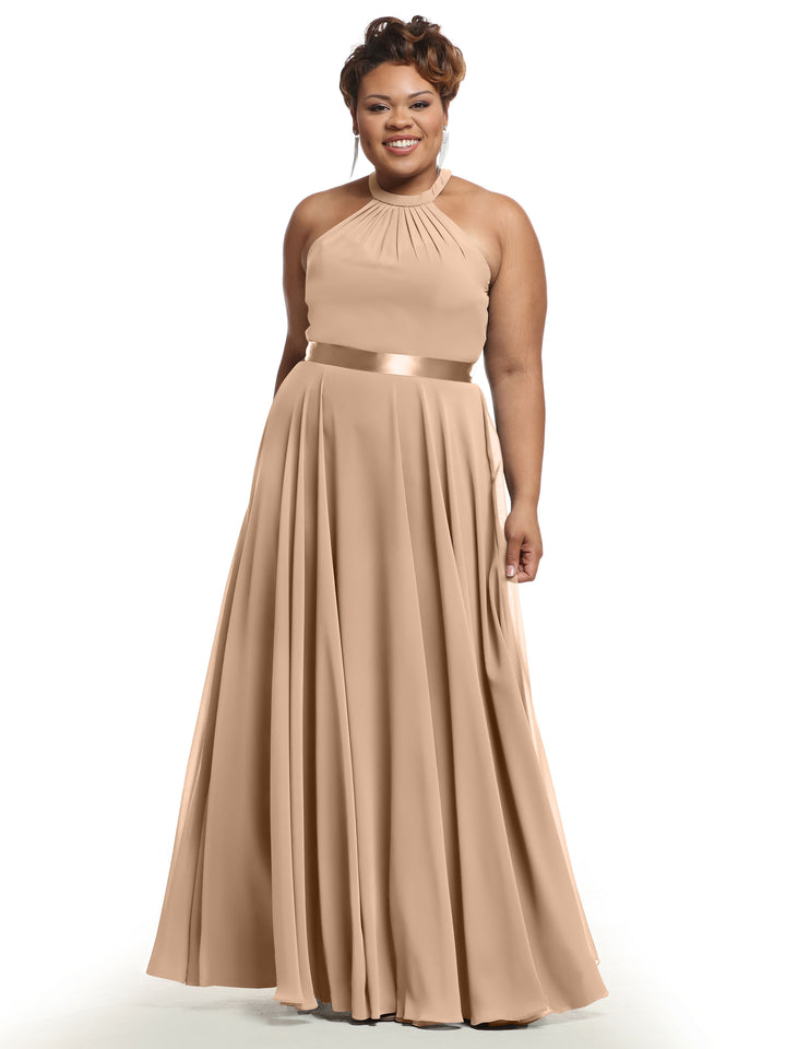 A woman in Avery Austin 80038, a sleeveless, floor-length Buff A-Line chiffon dress with a high neckline and satin waistband, smiles against a plain white background.