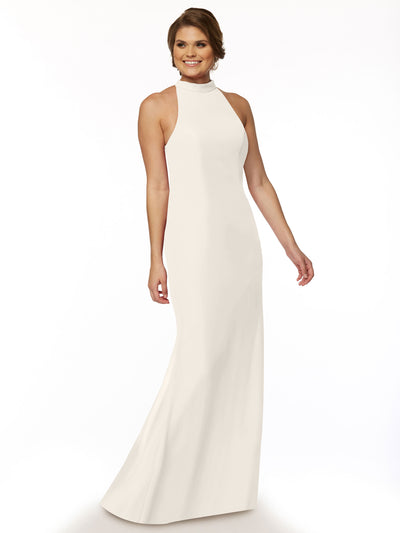 A woman stands and smiles against a plain white background, wearing Avery Austin's 80068—an ivory chiffon bridesmaid dress with a sleeveless, floor-length design and high neckline.