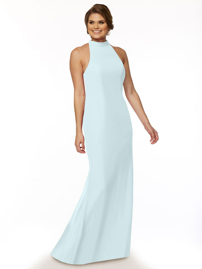A woman poses in Avery Austin's sleeveless chiffon bridesmaid dress (style 80068) in light blue with a high neckline, smiling with short styled hair against a plain white background.