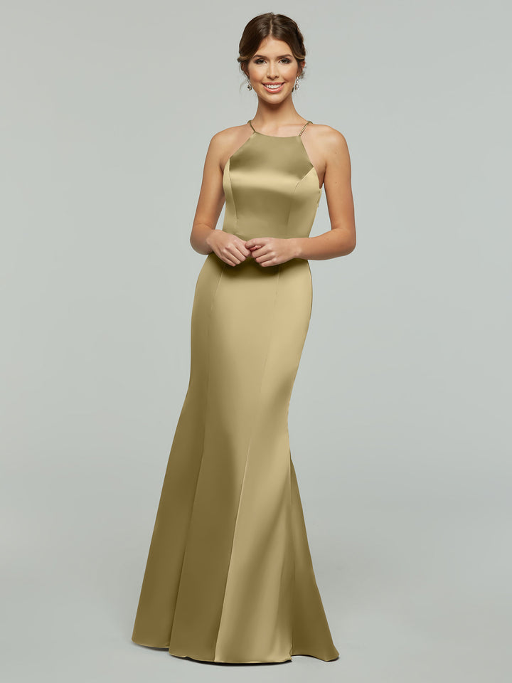 A woman smiles in Avery Austin’s 80071, a sleeveless gold satin gown with a halter neckline, fitted bodice, and flared floor-length skirt, set against a plain light gray background.
