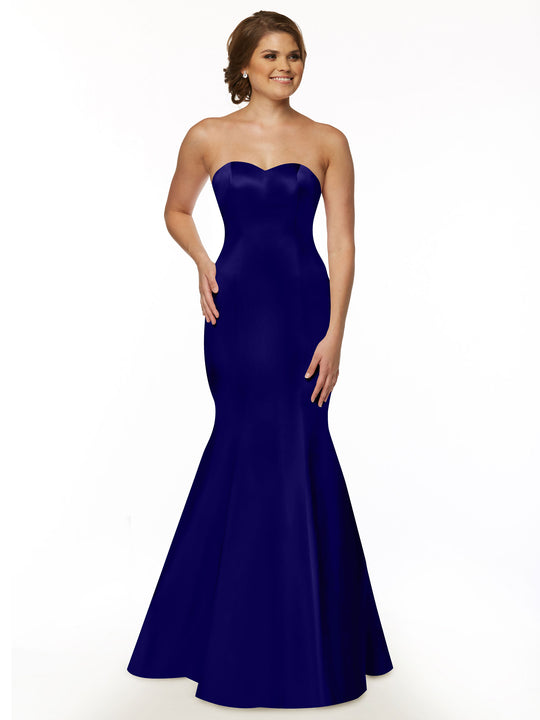 A woman models Avery Austin’s 80072 strapless satin mermaid bridesmaid dress in cobalt, posed against a plain white background.