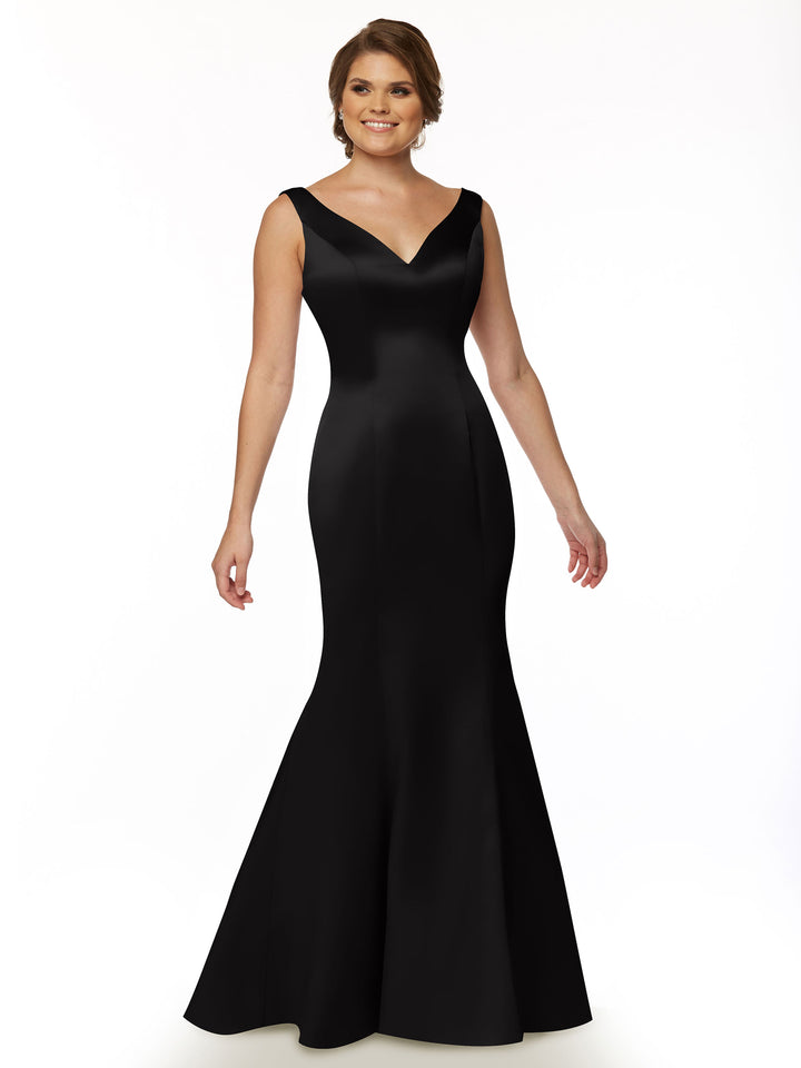 A woman smiles against a white background wearing the Avery Austin TH-80078, a black, long sleeveless evening gown with a V-neck and fitted mermaid-style silhouette.