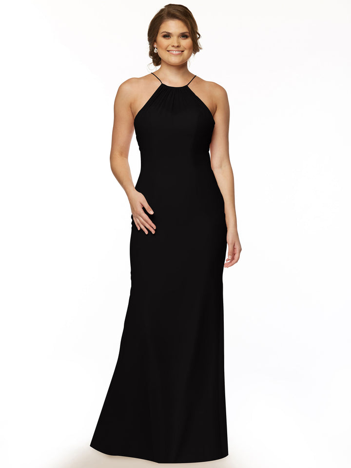 A woman wears Avery Austin style 80083, a sleeveless black chiffon halter gown with a keyhole back, standing and smiling against a plain white background.