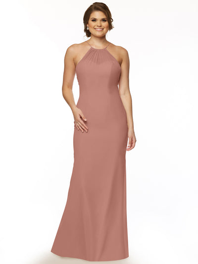 A woman smiles in the Avery Austin 80083, a sleeveless floor-length rose halter dress with a keyhole back. Her loose waves and hand on her hip stand out against a plain white background.