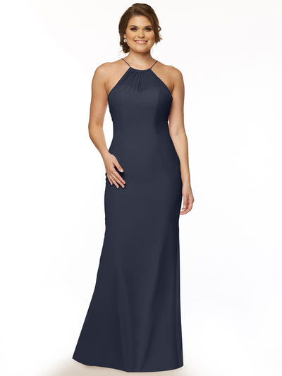 A woman models Avery Austin 80083, a sleeveless navy blue chiffon halter dress with a fitted silhouette and keyhole back, standing and smiling against a plain white background.