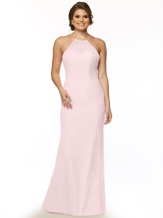 A woman smiles against a plain white background, wearing Avery Austin’s 80083—a sleeveless, floor-length light pink chiffon halter dress with a fitted silhouette and gathered neckline.