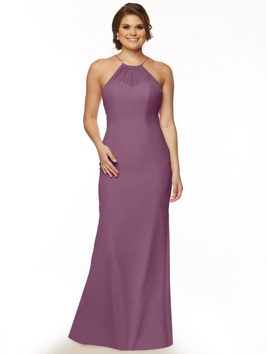 A woman poses against a white background in Avery Austin's mauve floor-length halter dress (style 80083) with a fitted bodice and hips, flared hem, chic keyhole back, and her light brown hair styled back.