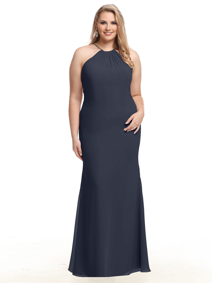 A woman models the Avery Austin TH-80083— a sleeveless, floor-length, dark navy chiffon halter dress—smiling against a white background with long, wavy blonde hair over one shoulder and her right hand at her side.