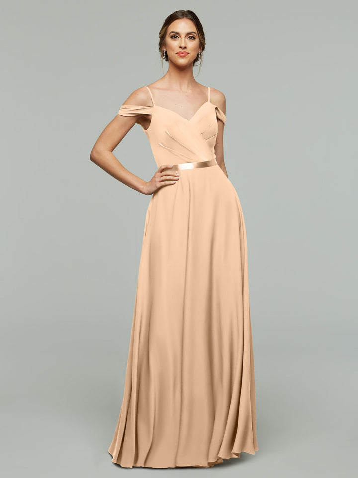 A woman poses confidently with her hand on her hip, modeling Avery Austin&