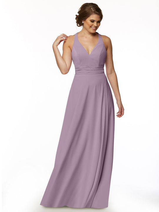 A woman smiles against a white background wearing Avery Austin's 80107: a sleeveless, floor-length lavender A-line dress with a deep V-neck and fitted bodice for an elegant feminine look.