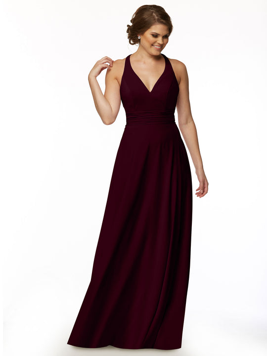 A woman models the Avery Austin 80107, a sleeveless floor-length A-Line burgundy dress with a V-neckline, posing against a white background and smiling as she gently touches her hair.