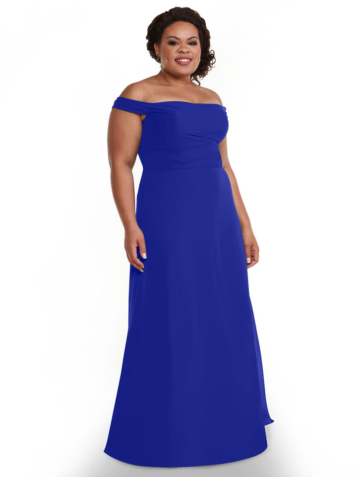 A woman in Avery Austin’s 80136 off-the-shoulder, floor-length royal blue chiffon dress smiles against a plain white background.