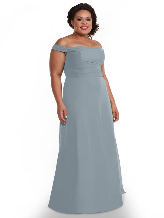 A woman wears Avery Austin's 80136, an off-the-shoulder, floor-length light blue chiffon dress, and smiles against a plain white background.