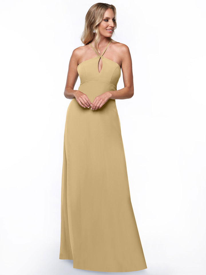 A woman models the Avery Austin 80137: a long, sleeveless light gold halter dress with a keyhole neckline, shown against a plain white background.