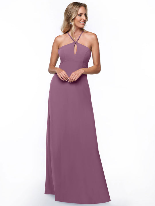 A woman wears Avery Austin's 80137: a mauve, sleeveless, floor-length halter dress with a small keyhole neckline cutout, standing against a plain white background.