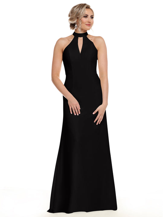 A woman models Avery Austin style 80138, a sleeveless, floor-length black gown with an open back and halter neckline. She stands against a white background with her light hair in an updo, gazing slightly left.