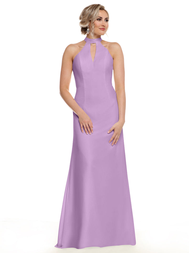 A woman poses against a plain white background in Avery Austin’s 80138, a sleeveless floor-length lavender gown with a halter neckline and front keyhole cutout, showcasing her shoulders.