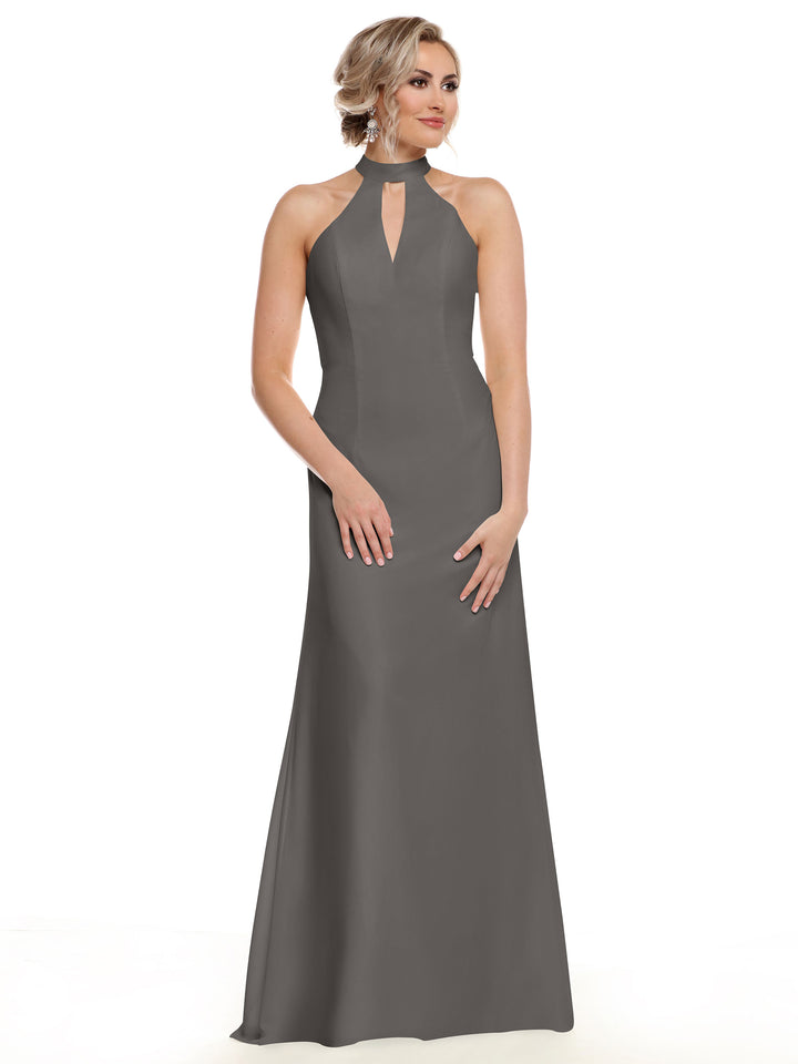 A woman stands against a plain white background wearing the Avery Austin 80138: a sleeveless, floor-length gray gown with a halter neckline and front keyhole cutout, perfect for showcasing your shoulders in effortless style.