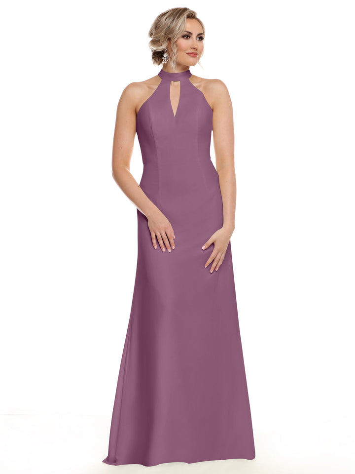 A woman models the Avery Austin 80138, a sleeveless, floor-length mauve gown featuring a halter neckline and keyhole cutout. Her blonde hair is styled in an updo as she poses elegantly against a plain white background.