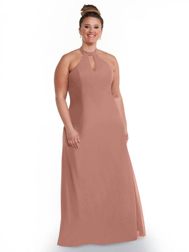 A smiling woman with brown hair in a bun models Avery Austin’s 80138: a sleeveless, floor-length mauve halter dress with a keyhole neckline, perfect for highlighting your shoulders, posed against a plain white background.