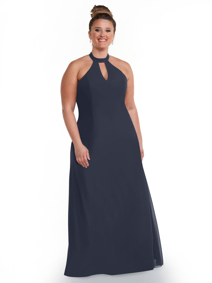 A woman models the Avery Austin TH-80138: a sleeveless, floor-length navy gown with an open back, halter neckline, and keyhole cutout, smiling against a plain white background.