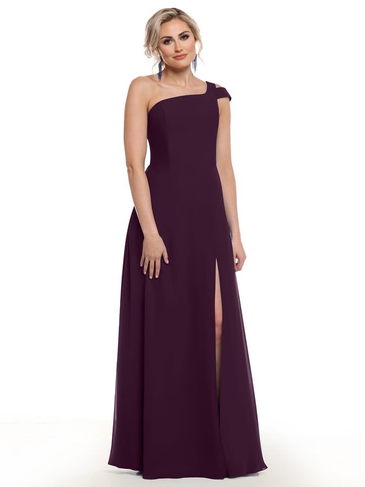 A woman models the Avery Austin 80139 dress in aubergine, featuring a one-shoulder design and thigh-high side slit. Her light hair is styled up as she poses against a plain white background.