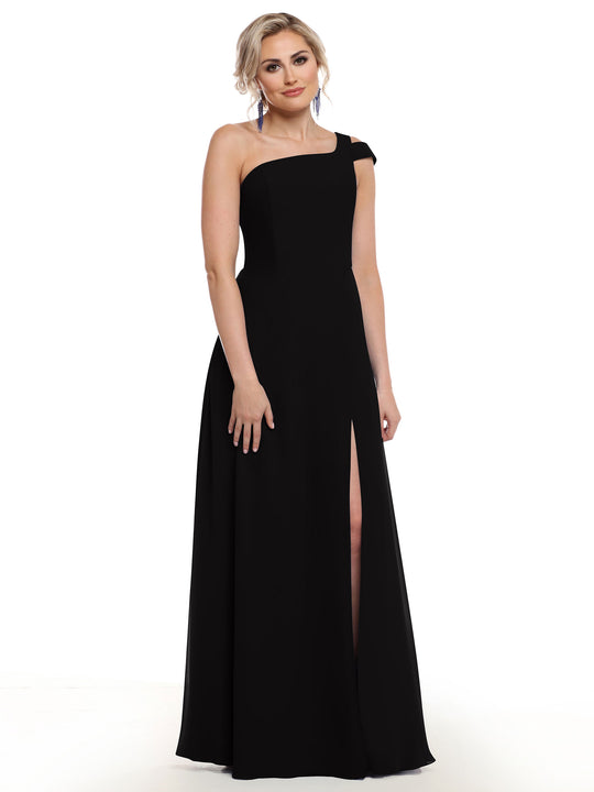A woman poses confidently in Avery Austin’s 80139: a long black one-shoulder dress with a thigh-high slit, styled elegantly against a white background. Her light hair is worn up, enhancing the sophisticated look.