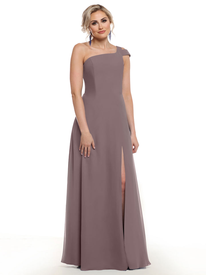 A woman models Avery Austin’s 80139, a sophisticated sleeveless mauve one-shoulder dress with a thigh-high side slit, against a plain white background.