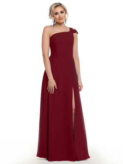 A woman poses against a white background in Avery Austin’s 80139 gown—a sophisticated, one-shoulder burgundy dress featuring a thigh-high side slit.